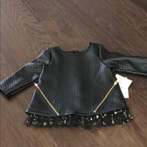 Leather like top with star tulle trim